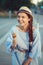 Closeup portrait of beautiful happy white Caucasian brunette girl woman with dimples on cheeks and tanned skin eating ice cream