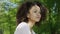 Closeup portrait of a beautiful mixed race woman smiling warmly to a camera.