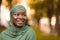 Closeup Portrait Of Beautiful Smiling African Islamic Woman In Hijab Standing Outdoors