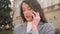 Closeup. Portrait of businesswoman talking phone at street. Woman having phone talk outdoor