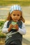 Closeup portrait of a caucasian four year old toddler girl drinking juice outdoors