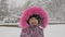 Closeup portrait of cute adorable baby girl outdoor in snowy frosty winter park