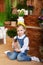 Closeup portrait of cute little girl and brown rabbit at home. Child plays with a rabbit in backyard. Easter. Concept child and an