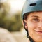 Closeup portrait, cycling helmet and smile for man at mountain bike park, competition or contest. Happy cyclist, face