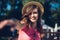 Closeup portrait of effective girl with long curly hair smiling to camera having fun on the beach, dancing and smiling, vacation m