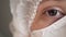 Closeup portrait of experienced caucasian female surgeon, doctor with mask ready to work in a hospital or clinic. Eyes