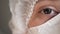 Closeup portrait of experienced caucasian female surgeon, doctor with mask ready to work in a hospital or clinic. Eyes