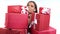 Closeup portrait fashion happy woman holding stack of wrapped red festive gift box isolated on white
