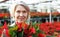 Closeup portrait of female florist with poinsettia