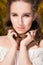 Closeup portrait of glorious brunette woman standing near yellow