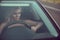 Closeup portrait of gorgeous tanned blond lady driving the