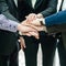 Closeup portrait of group of business people with hands together