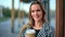 Closeup portrait of happy blonde woman with coffee paper cup posing. Shot with RED camera in 4K