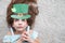 Closeup portrait of a happy preteen caucasian girl in an emerald leprechaun St. Patrick`s Day hat