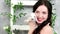 Closeup portrait of happy smiling woman holding white cute long-eared rabbit, spring photo session