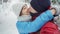 Closeup portrait of happy smiling young couple walking in snowy winter park at cold winter day. man and woman lovely