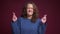 Closeup portrait of hopeful young caucasian female having her fingers crossed anxiously and praising