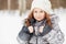 Closeup portrait of little girl in grey jacket with fur collar