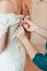 Closeup portrait of a maid of honor helping the bride