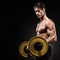 Closeup portrait of a muscular man workout with barbell at gym.