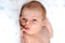 Closeup portrait of Newborn baby on white blanket. Soft focus. A two weeks old infant is sleeping tightly on her side in bed. 14