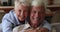 Closeup portrait older wife cuddles husband smile look at camera