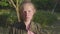 Closeup portrait of pretty teenage sad girl looking at camera. White happy smiling kid with natural blonde long hair