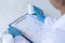 Closeup portrait, Scientists in white lab coats are analyzing the vital substance of the sample drug in a lab