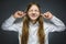 Closeup portrait of screaming girl covering her ears, observing. Hear nothing. Human emotions, facial expressions