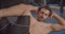 Closeup portrait of shirtless muscular handsome caucasian man swinging press elbow to knee in the gym indoors