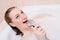 Closeup portrait of singing beautiful blonde young woman relaxing in spa bath with foam having fun happy smiling image