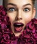 Closeup portrait of a surprised young woman