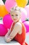 Closeup portrait of tender teenager with balloons