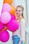 Closeup portrait of tender teenager with balloons