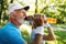 Closeup portrait, thirsty senior man drinking water outside