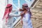 Closeup portrait of two Arab guys fighting, Aggressive behavior, on city background