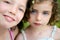 Closeup portrait of two little girl sisters