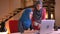 Closeup portrait of two young beautiful muslim businesswomen emotionally discussing a topic in front of the laptop then