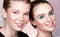 Closeup portrait of two young pretty women. Bright professional makeup