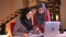 Closeup portrait of two young successful muslim businesswomen discussing the data and graph in front of the laptop then