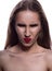 Closeup portrait of wicked brunette girl with bright makeup, posing on a white background