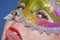 Closeup portrait of woman in Mardi gras masquerade mask