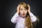 Closeup Portrait of wondering girl going surprise on gray background