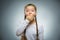 Closeup Portrait of wondering girl going surprise on gray background