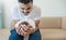 Closeup portrait of young asian Indian father holding his newborn baby with copy space.