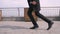 Closeup portrait of young attractive african american businessman performing a moonwalk on the street in the urban city