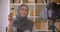 Closeup portrait of young attractive muslim beauty blogger in hijab talking on camera making product review indoors