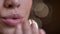 Closeup portrait of young beautiful womans lips. Seductive female making an air kiss straight to the camera