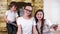 Closeup portrait of young brother and sisters at home atmosphere, children having fun with gadgets