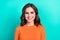 Closeup portrait of young charming positive smiling lady brown curly hairstyle wear orange stylish top good mood